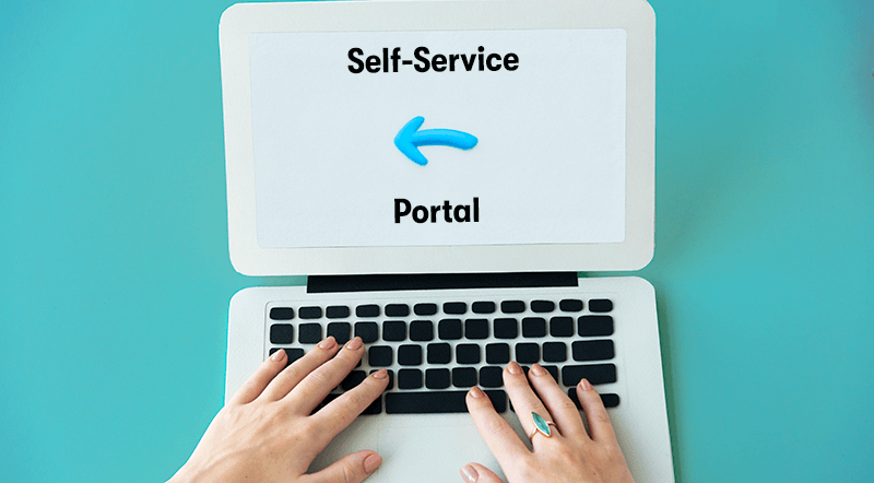 A picture of two hands using a laptop. On the laptop screen is the text Self-Service Portal with a logo in the middle. On a light blue background.